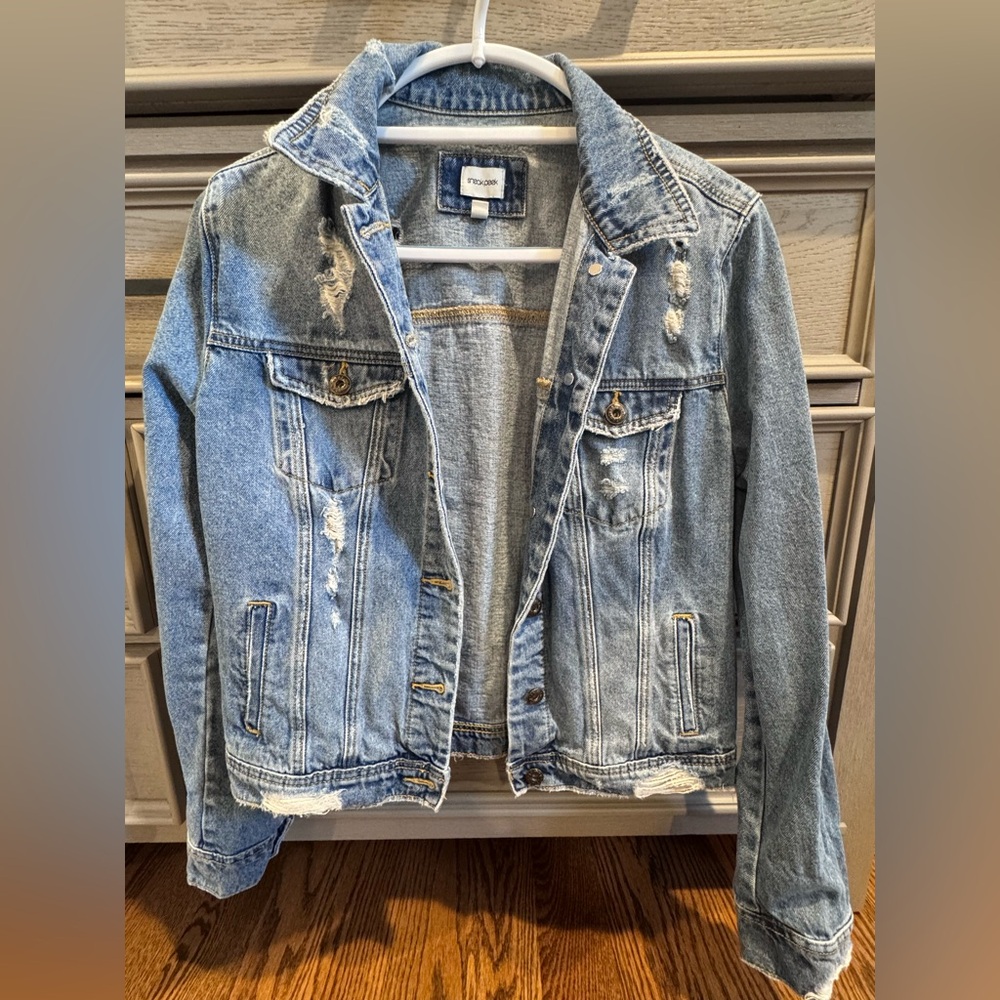 Distressed medium wash denim jacket
